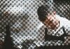 Recruitment firms caught up in rise in illegal working penalties A man working behind a partly shieled glass screen.
