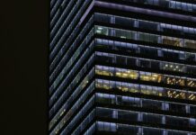 Workers lose £28 billion a year to unpaid overtime, TUC warns An office building with lights still on.