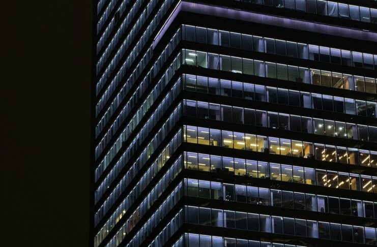 An office building with lights still on.