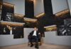 Return-to-office mandates linked to narcissistic leaders, researchers claim A businessman in a suit sitting confidently in a modern office setting.