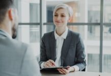 Recruiters warned to move beyond ‘post and pray’ as passive talent overlooked A woman interviewing a candidate in a modern office.