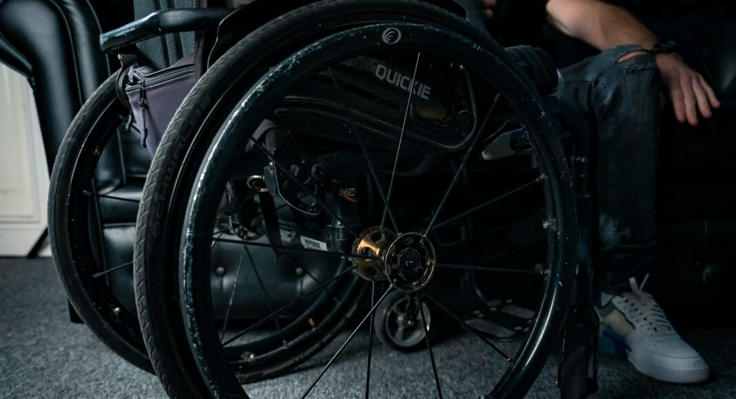 A close-up shot of a wheelchair's wheels.