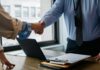 HR hiring rises as firms respond to compliance pressure and employment law changes Two people shake hands after a job interview lead to an employment offer.