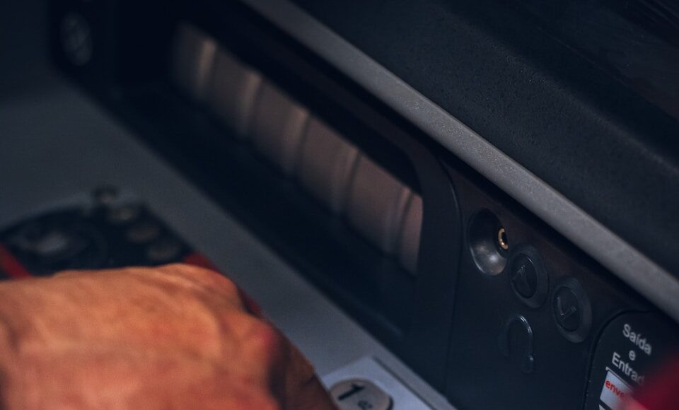 A person using an ATM.