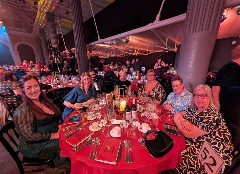 People sit around a table at the Investors in People Awards.
