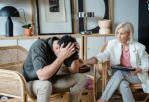 Mental health crisis could cost UK £170bn as workforce participation falls, report warns A supportive therapist provides comfort during a counseling session in a cozy office.