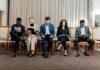UK employers ‘risk falling behind global rivals on AI hiring’ People sitting on chairs waiting to be interviewed for a job.