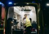 Young workers ‘pressured into signing NDAs after workplace injuries’ Paramedics attend to a patient inside an ambulance, providing emergency medical assistance at night.