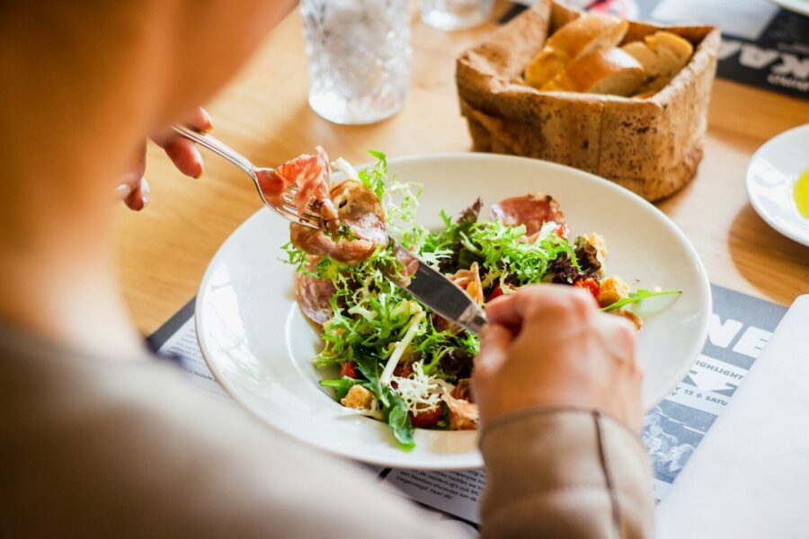 A person having a salad for lunch.