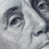 Close-up view of a detailed portrait of Benjamin Franklin from a U.S. one hundred dollar bill, reminiscent of the precision and attention to detail often demanded in People Management roles within Human Resources.