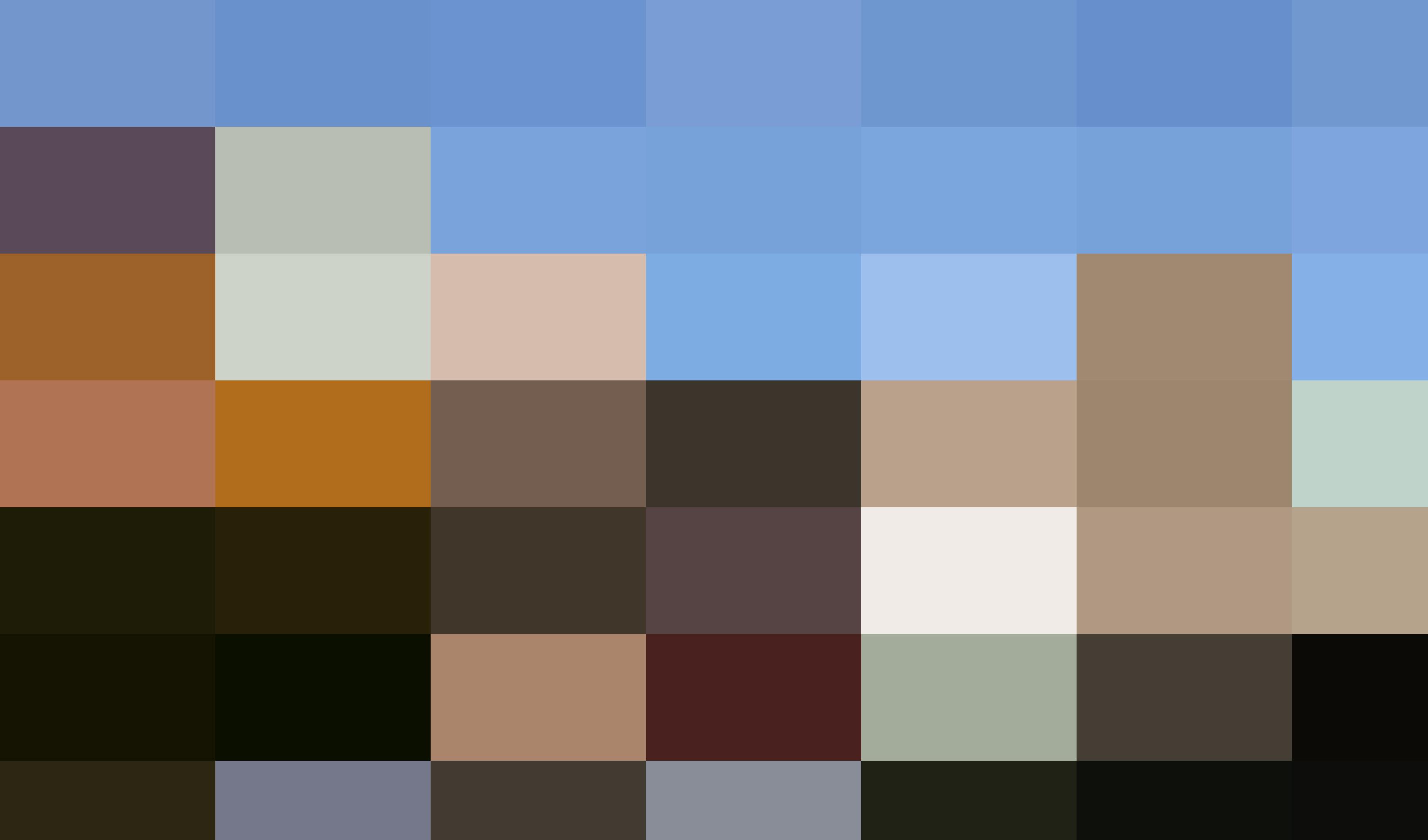 Modern and historic hospital buildings with a glass entrance and an art deco style tower, surrounded by trees in autumn, house the human resources department.