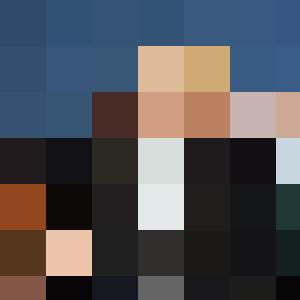 A man in a suit and tie engaging employees with people management skills.