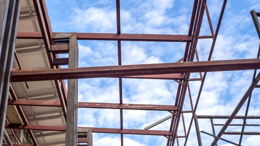 the wooden planks of a roof, with the sky above