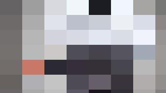 A personnel member in a business outfit showing empty pockets, signifying no money.