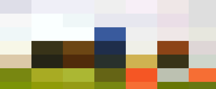 Group of seven personnel joyfully jumping on a grassy field by the water, with one person kneeling and smiling.