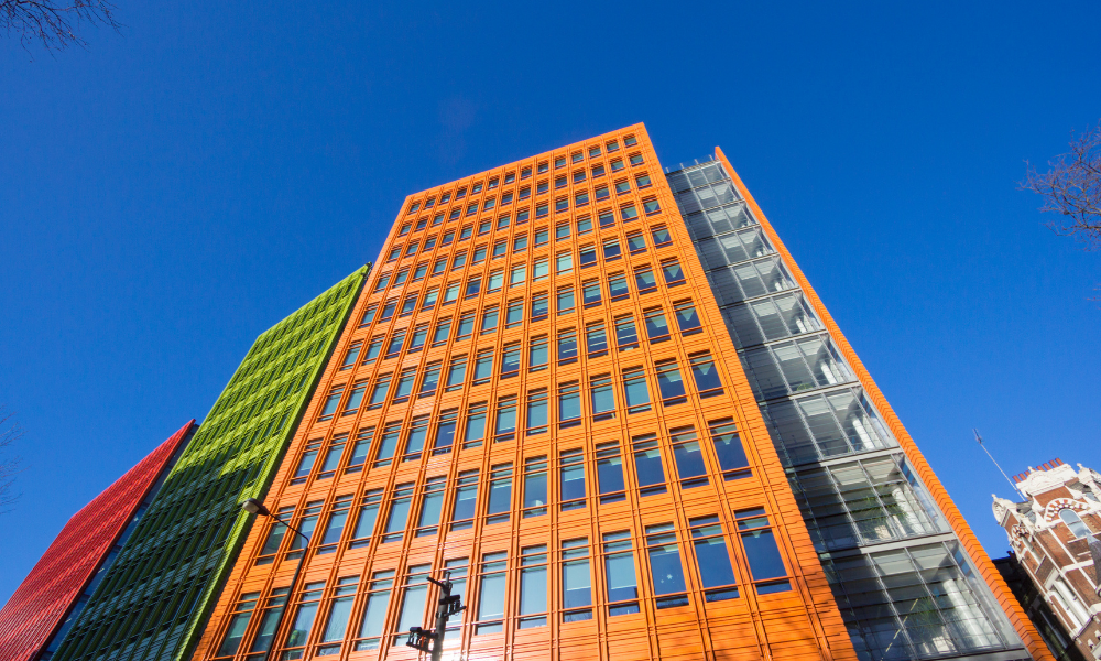 the central st Giles building from the bottom, this is the orange panel of the building that we are looking at against a blue sky