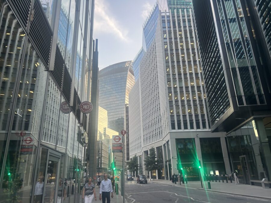 People walking along the City financial district of London.
