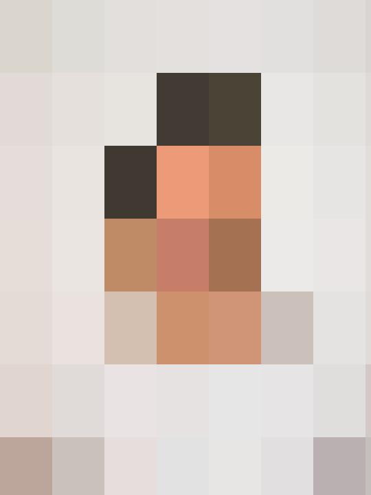 A man in a white shirt smiles for the camera.