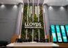 Lloyds plans 1,000 AI roles as debate over jobs impact continues A reception area at a Lloyds Banking Group office with two staff behind the desk.