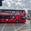 Two London buses on a street.