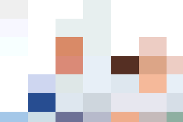 Human Resources professionals smiling during a meeting in a bright office setting.