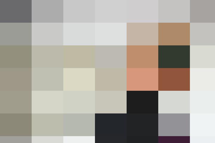 A man in a suit and tie standing in front of a sign, possibly related to HR or personnel.