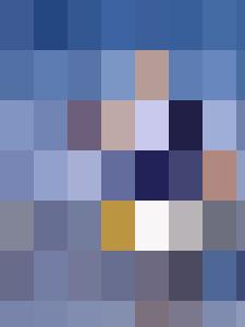 An older couple strolling along the beach.