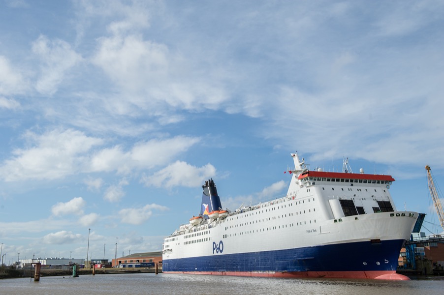 A large white and blue ship, identified with 