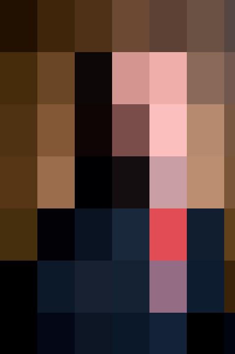 A man in a suit and tie smiling for the HR camera.