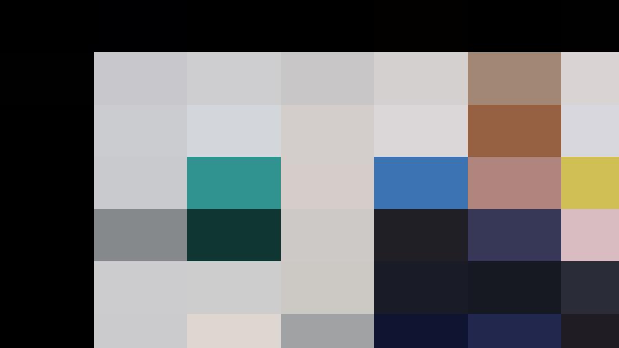 A man with grey hair wearing a dark blazer sits in front of a wall displaying colorful geometric artwork, embodying the essence of experienced personnel management.