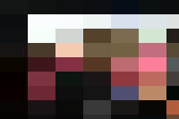 Four girls are jumping up and down in front of a building, showcasing their exuberance through their joyful movements.