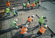 ‘Silent killer’ dust linked to 500 construction deaths a year as 600,000 workers face exposure A group of workers at a construction site.