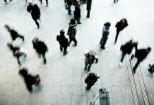 Hiring slowdown shows signs of easing as permanent placements near stabilisation People walking on a street.