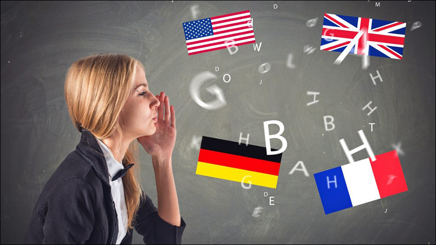 A woman blows scattered letters toward the flags of the United States, United Kingdom, Germany, and France pictured on a blackboard background, symbolizing international People Management.