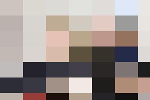 A diverse group of business people sitting at a conference table for HR training.