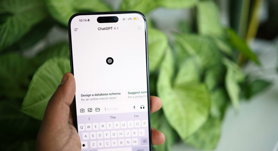 A person holding a phone displaying the ChatGPT app.