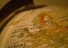 UK wage tax burden rises fastest among rich nations as hiring concerns grow Close-up of a vintage globe showing Europe.