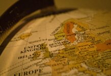 UK wage tax burden rises fastest among rich nations as hiring concerns grow Close-up of a vintage globe showing Europe.