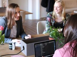 Govt launches gender pay gap and menopause action plans to help women ‘thrive at work’ A group of women sitting around a table.