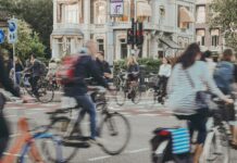 Habits for health: small changes that lead to bigger gains A blurred image of people cycling along a street.
