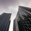 A view from ground level of skyscrapers in Manchester, UK.