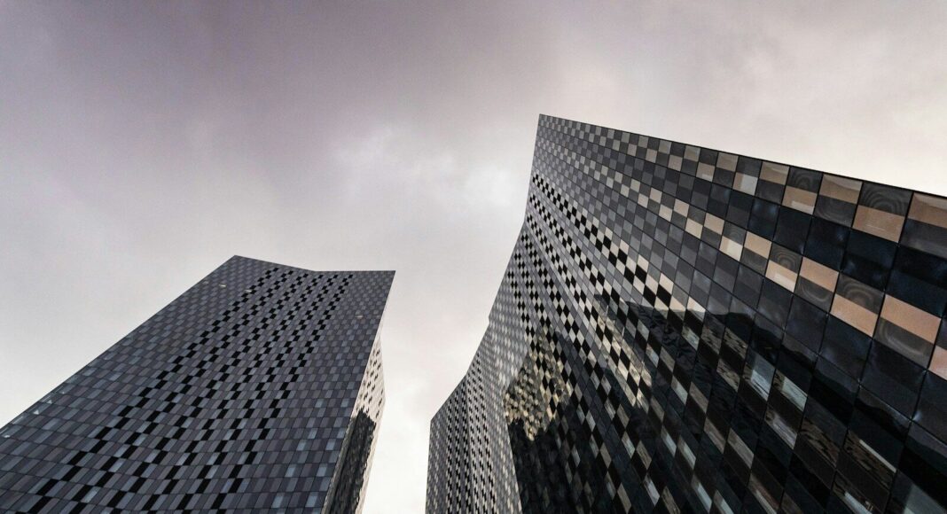A view from ground level of skyscrapers in Manchester, UK.