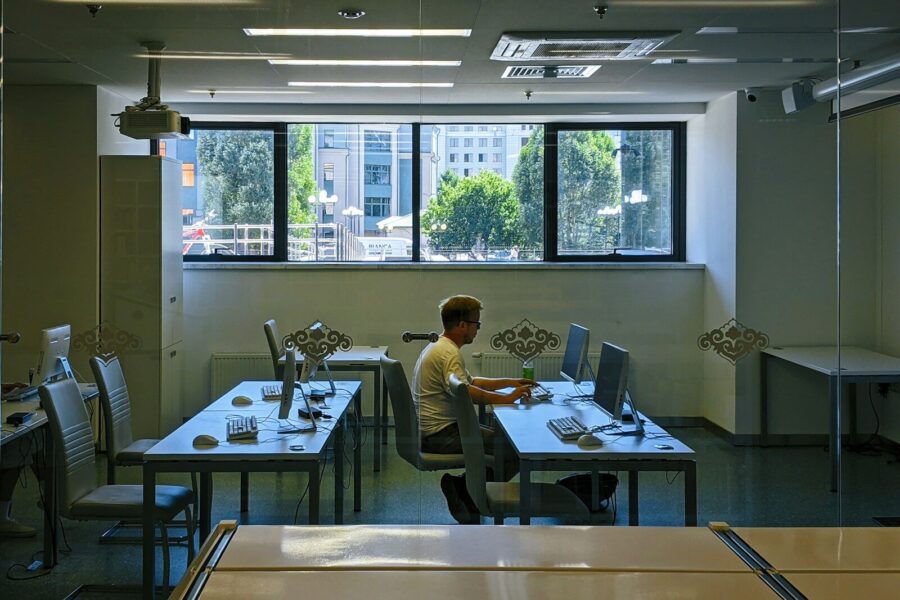 A man sitting at a desk in an office.