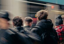 Ministers reconsider youth minimum wage plans as unemployment rises A group of people standing next to each other.