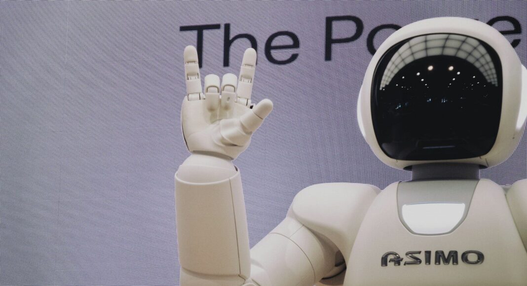 A robot m aking a sign with a hand.