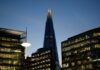 Pay awards rise to 3.2% as employers balance caution with hiring pressures The Shard towers above other london buildings at dusk.
