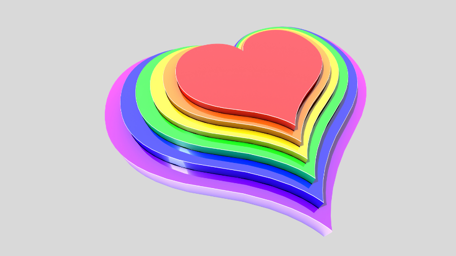 A multi-layered heart-shaped object with layers in pink, yellow, green, and blue colors on a gray background symbolizes unity and diversity reminiscent of the values upheld by the Gender Recognition Act.