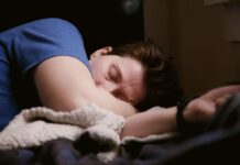 Falling healthy life expectancy adds pressure to jobs market as sickness rises A person lying in bed, sick.