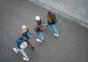 UK risks ‘lost generation’ as youth unemployment crisis deepens A group of young people walking down a street, viewed from above.