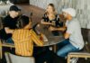 Guaranteed hours reforms could reduce hiring and hurt young workers, employers warn A group of young people working with laptops at a table.